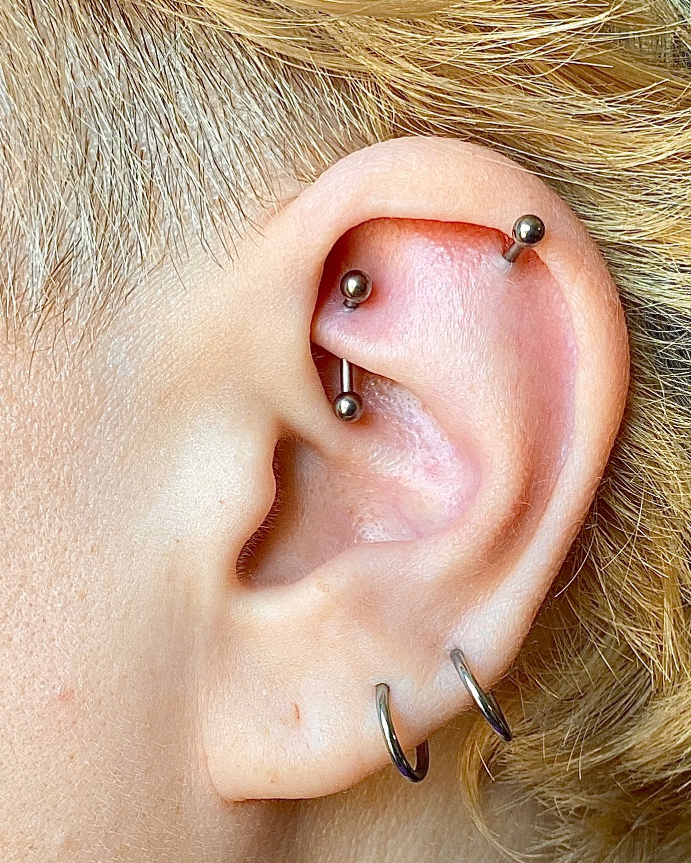 Ear Full of Piercings